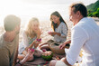 © Alexander Grabchilev/Stocksy - Picnic On A Beach
