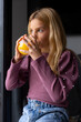 © VICTOR TORRES/Stocksy - Girl drinking fresh juice from glass