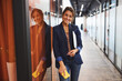 © Viacheslav Yakobchuk - Charming happy smiling female consultant posing and looking at the photo camera