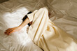 © ulas & merve/Stocksy - woman lying on bed