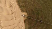 AERIAL. Circular Green Irrigation Patches For Agriculture In The Desert. Dubai, UAE.
