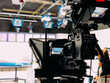 © David Prado/Stocksy - Professional video camera in TV studio