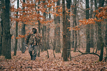 Bow Hunter In Ghillie Suit