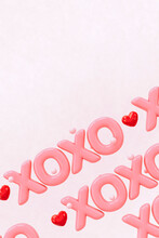 XOXO - Hugs And Kisses Abbreviation- 3D Render Of The Word "XOXO" On A Pink  Background With Red Hearts - Vertical