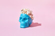© Yaroslav Danylchenko/Stocksy - Popcorn in blue human skull