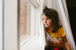 © Maria Manco/Stocksy - little girl plays in curtain