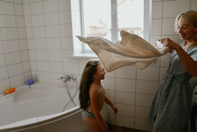 Mother Bathes Her Little Daughter