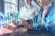 © VideoFlow - Businessman and businesswoman in formal wear working together to optimize trading strategy at corporate finance fund. Forex chart hologram over office background with panoramic windows