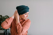 © Julia Volk/Stocksy - Woman Wrapping Turban On Head