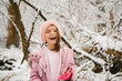 © Maria Manco/Stocksy - girl laughs in winter woods