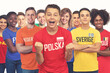 © Daniel Ernst - Cheering polish football fan with group of other european supporters