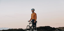 Male Cyclist Looking At The Sunset