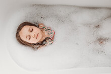 Girl Laying In Bubble Bath