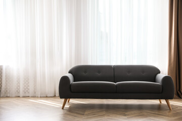 Poster - Comfortable grey sofa near window indoors, space for text. Interior design