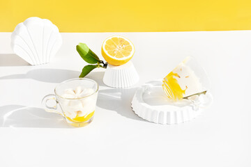 Wall Mural - Lemon mousse or ice cream in a glass cups on yellow background. Traditional Italian recipe of lemon tiramisu or granita. Delicious summer dessert.