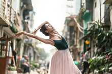 Female Ballet Dancer Is Posing Outdoors In City