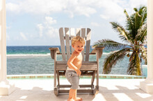 Toddler In Caribbean Overlooking The Sea