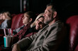 © Sean Locke/Stocksy - Movies: Adult Couple Watching Movie On Date Night