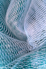 macro of green and white mesh fabric patterns