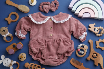 Wall Mural - Flat lay composition with baby clothes and accessories on blue background