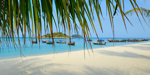 Wall Mural - long tail boat, in white sand beach in the andaman sea