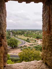 Poster - View of the fort walls and surrounding countryside from a rectangular window in the Thirumayam Fort.