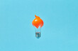 © Yaroslav Danylchenko/Stocksy - Light bulb with orange slime