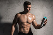 © blackday - Bodybuilder drinking whey protein or other supplement from a metal shaker