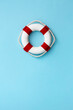 © Ruth Black/Stocksy - Life ring on a blue background