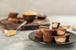 © New Africa - Delicious peanut butter cups on light grey table, space for text
