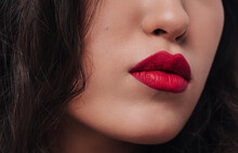 Woman With Red Lips And Dark Hair
