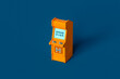 © Giada Canu/Stocksy - a single Orange arcade cabinet on blue background