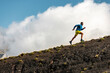 © Manu Prats/Stocksy - Sportsman running in mountains on foggy day