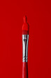 © Juan Moyano/Stocksy - red paint in a red paintbrush