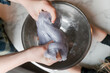 © Lexia Frank/Stocksy - child making purple glittery slime
