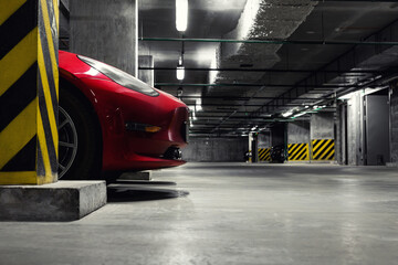 Wall Mural - Dark scenic car park underground multilevel garage interior. Concrete cement column covered building basement floor electric vehicle parking lot zone. Modern urban city traffic infrastructure concept