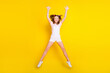 Full length body size view of pretty funky cheerful girl jumping having fun free time isolated over bright yellow color background