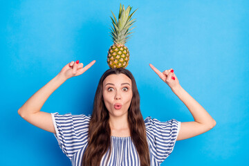 Sticker - Photo of excited sweet lady wear off-shoulders clothes holding head pointing fingers pineapple big eyes isolated blue color background