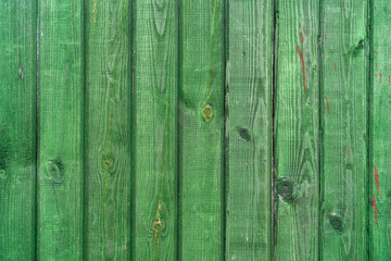 Wall Mural - Closeup shot of an old green wooden surface with planks