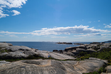 the beautiful coast of norway with its rock formations and blue water on a beautiful summer day