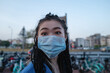 © Pansfun Images/Stocksy - Fashion young Asian woman wearing mask on city street