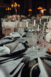 © Olga Moreira/Stocksy - Table in a restaurant set for a festive dinner
