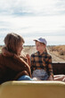 © Claira Whipp/Stocksy - kids sitting in the back of a vehicle on a farm