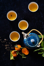Tea Set With Orange On Dark Blue Velvet