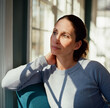 © Jakob Lagerstedt/Stocksy - Portrait of a beautiful woman sitting in a chair with shadows falling across her face and body