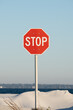 © Maryanne Gobble/Stocksy - Red Stop Sign at the Beach