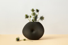 Green Twigs In Black Ceramic Vase