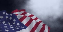 Composition Of Billowing American Flag And Smoke On Dark Background
