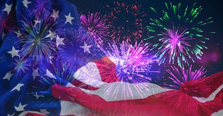 Wall Mural - Composition of american flag billowing over colourful fireworks in night sky