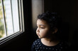 © Saptak Ganguly/Stocksy - Innocent child in pensive mood